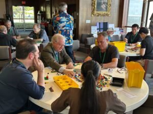 Attendees collaborating during the LEGO build session